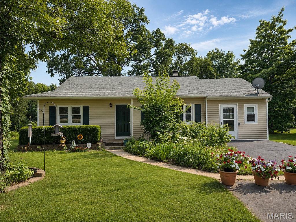 This charming home offers a blend of comfort and potential. With 2 bedrooms, 1 bathroom, main floor laundry, eat in kitchen and an additinal room easily used for an office, additional sleeping room, or another living room, and on approx 2 acres. What a great starter home and when you are ready to expand you have plenty of room for that.  Outdoor area is great for gardening, entertaining or just relaxing.  We invite you to explore the endless possibilites at this home.  This is a great location just outside town near Hwy 21.  If you want the country life on budget this is your spot!  Move in ready and awating it's next chapter.  Both sheds and washer and dryer will remain.