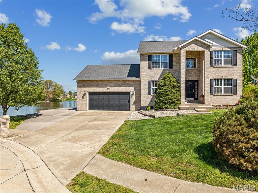 Stately two-story home with picturesque lake views in sought-after Lakeview Estates. This 5-bedroom, 3 1/2-bath residence offers a bright, open floor plan with spacious living areas, formal dining, and a well-appointed kitchen ideal for everyday living and entertaining. The main living area features a fireplace, and a separate office space provides flexibility for remote work or study. The primary suite includes a walk-in closet, extended vanity, and serene water views.

Enjoy exceptional outdoor living with upper and lower decks overlooking the lake, perfect for morning coffee and evening sunsets. This is one of only seven lakefront properties with private dock access, and includes a paddleboat and trolling motor, offering a peaceful, recreational lakefront lifestyle. An extra-large driveway provides ample parking and added convenience.

The walkout basement features a full Rathskeller-style entertaining space, complete with full heating and cooling ductwork, making it ideal for year-round use. The lot offers added openness with adjoining space, enhancing privacy and overall setting. Estimated over 3,000 sq ft of living space.

Conveniently located near top-rated Waterloo schools, shopping, dining, and major commuting routes. A rare opportunity to enjoy lakefront living with both comfort and functionality.