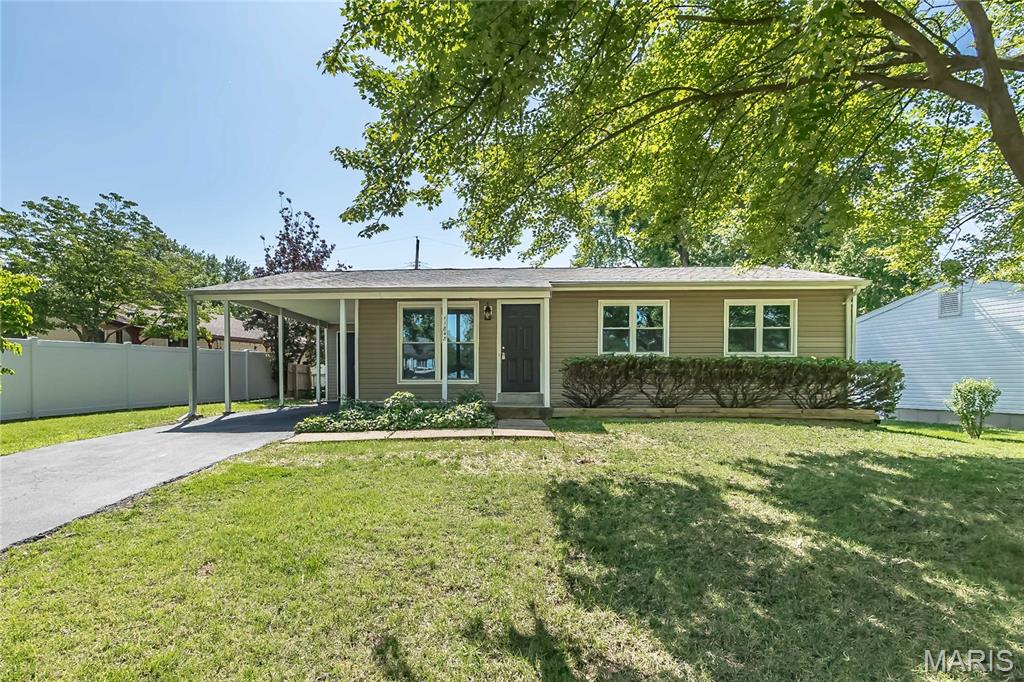 This three bedroom, two bathroom ranch home situated on a level, fenced lot is move in ready. Upstairs find three bedrooms, a large bathroom, refinished wood floors. Lower level is finished with large rec room area and new second full bathroom. Recent updates include new roof (June 2026) refinished wood floors, interior paint, water heater (2026), basement finish, and new plumbing stacks, vents, drains, water lines, fenced yard, carport, covered patio. All building inspections passed as well as Maryland Heights Occupancy.