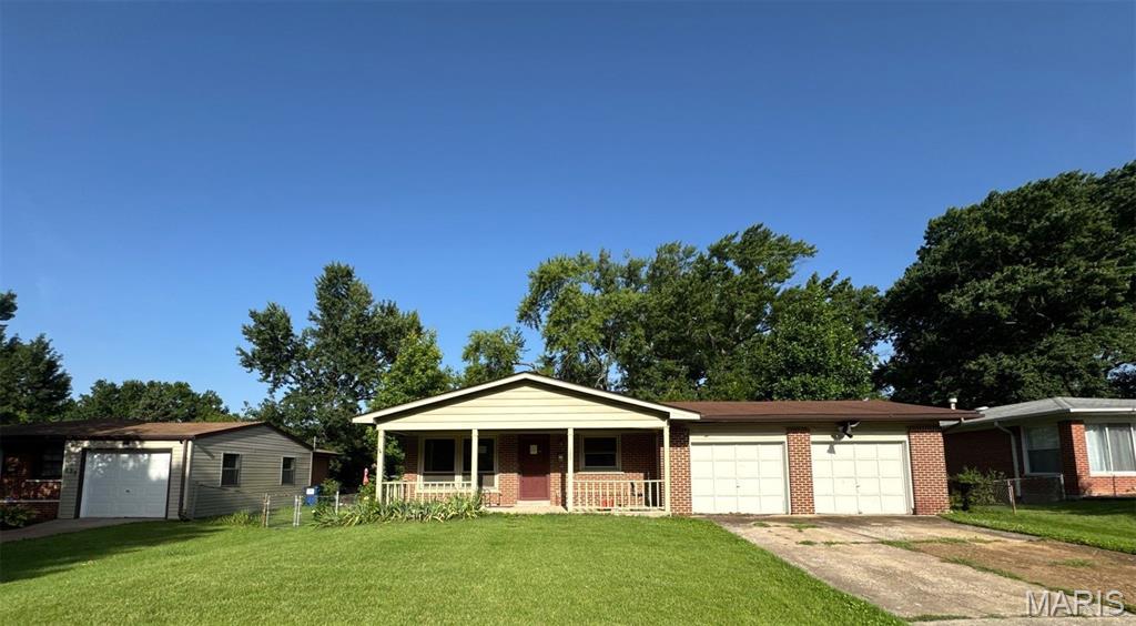 Welcome to 125 Saint Benedict Lane in Florissant! This classic single-story brick ranch offers approximately 1,215 square feet of main-level living space featuring 3 bedrooms and 2 full bathrooms. The layout includes an open front porch entry, an attached 2-car garage for convenient covered parking and storage, and a full basement providing substantial additional space for storage, utilities, or future customization. Situated on a level lot, home combines solid structural character with practical functional features.