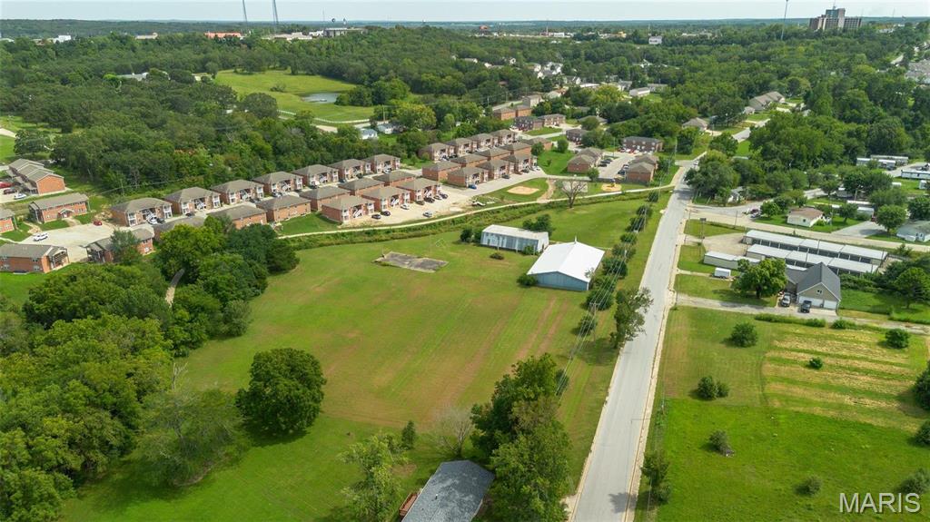 4.43 acres of prime real estate to start a business or build a housing subdivision. The metal building used for a church is about 4000 square feet and the other metal budling that is a gymnasium is also about 4000 square feet. With the close proximity to S&T, dining, and the 8000 +/- square feet of buildings makes this the perfect multi use property for anything you can imagine! Call today for a showing and this land and buildings!