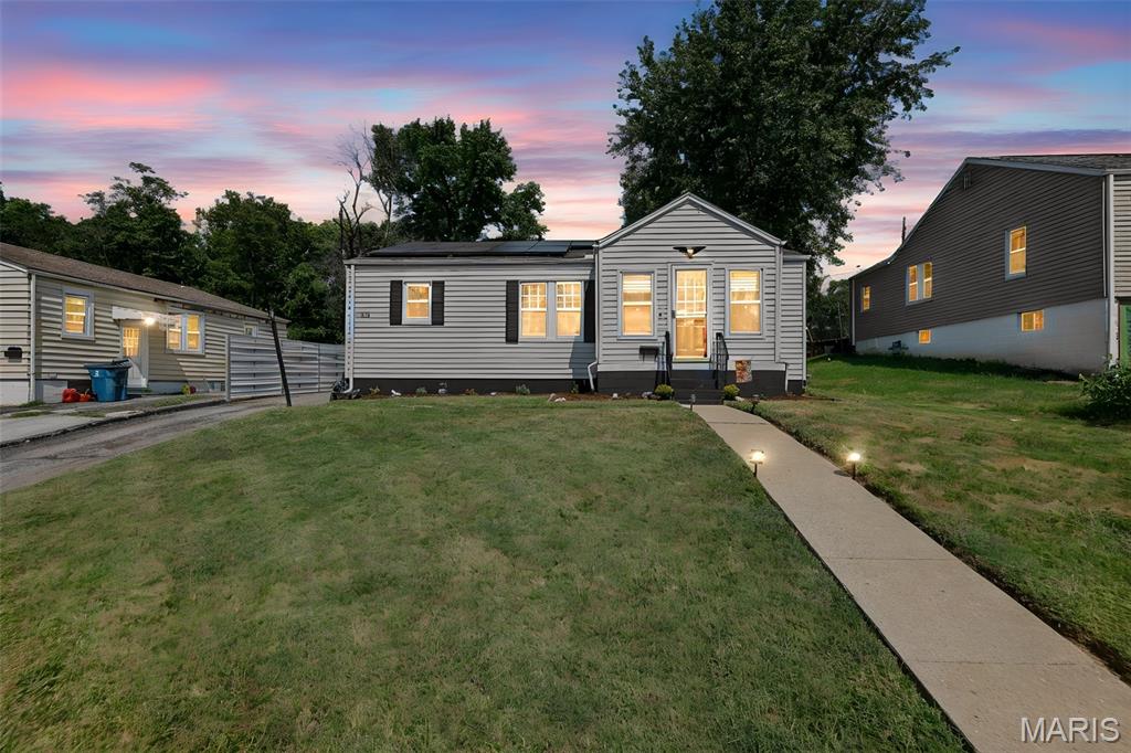 Enjoy peaceful living on a quiet dead-end street in North Alton! This well-maintained 3-bedroom, 1-bath home offers comfortable living spaces, thoughtful updates, and a backyard that feels like your own private retreat. Newer flooring throughout gives the home a fresh, welcoming feel, while the kitchen features a new sink and stove. A new sliding glass door provides easy access to the beautifully shaded backyard, complete with privacy fencing, a covered deck, and mature trees—an ideal spot for morning coffee, summer gatherings, or simply relaxing outdoors.
Additional updates include a new electric panel and two new sump pumps in the basement. Solar panels installed in 2023 add energy-efficient benefits and come with a transferable full warranty covering both the panels and the roof. The solar lease payment is $133/month. With its combination of outdoor charm, important updates, and solar features, this North Alton home offers an inviting opportunity for buyers looking for comfort, privacy, and added energy efficiency.