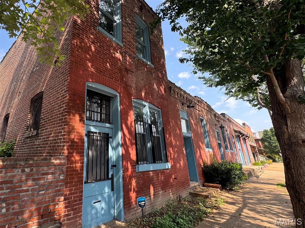 Secluded open and awesome raw space in the heart of Lafayette Square.  What would you do with the opportunity to reimagine this epic warehouse space on an quiet nook of a historic neighborhood. Bring your vision and take this opportunity to create a custom dream. Come see what life can be in this one of a kind neighborhood. 3000+ sq ft - commercial garage door off the alley. Half block from the commercial strip, one block from the park.  AS-IS, Cash only sale, initial estimates of roof work and masonry needed would be additional $100,000 not included in sale.