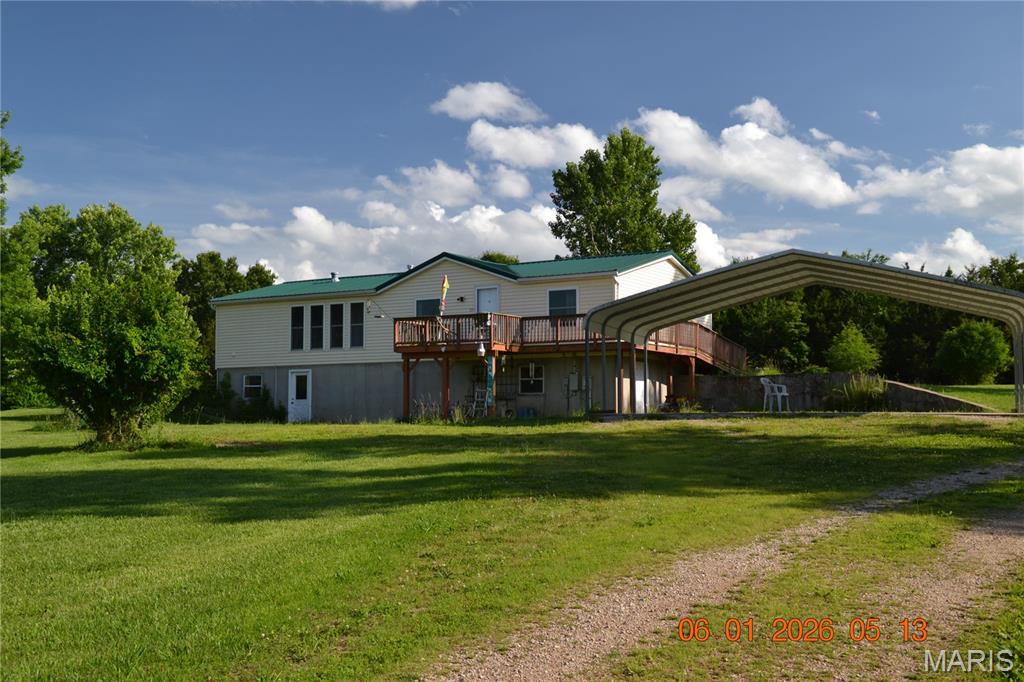 Welcome home with room to roam, on this private, secluded 10 acre tract of land, Mostly cleared, but some trees as well. 3 bedroom 3 bath home on full dry basement.   Heavily secured with 5 steel "I" beams running length wise and 8 steel "I" beams running width wise, in basement that has multiple walk outs.  Plenty of room for additional bedrooms in basement, as well as 2nd kitchen area in basement for "mother-in-law" quarters if desired.  3 car carport on concrete pad, AND a detached 30x60 shop with full concrete floor, and multiple bay doors.  Lots of space for storage, boat/RV parking or just about any "toys" you need covered. Water softener is owned, owner has codes for starlink hook-up, security system, 3 year old metal roof, some real wood floors, updated kitchen cabinets with "soft-close" doors, Updated HVAC and water heater, lots of windows for natural lighting and open floor plan for entertaining, septic was pumped aprox 1 year ago.  This listing offers a gorgeous 10 acres with a nice home, incredible shop and room to do just about anything you can dream up.  Call for your personal tour TODAY !!!  It is hard to find 10 acres that offers this much !!!