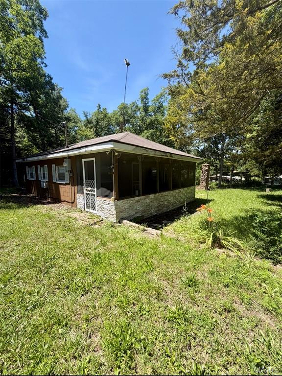 Quaint cabin in a lake community! This 2-bed 1-bath property is situated on a double lot with over 500 square feet of living space. Wanting a private getaway or potential investment property? This is the one for you!