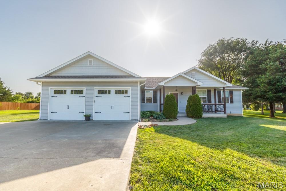 Meticulously maintained and showing like new, this beautiful home is located in a quiet neighborhood just outside the city limits, offering the perfect blend of peaceful living and everyday convenience. Inside, you’ll find an inviting open floor plan with vaulted ceilings, hardwood floors, a cozy fireplace, and abundant natural light. The stunning kitchen features custom cabinetry, granite countertops, stainless steel appliances, a large center island, and plenty of storage. The spacious primary suite is a true retreat with a luxurious ensuite bath complete with a freestanding soaking tub, oversized tiled walk-in shower, dual vanities, and generous closet space. Every detail reflects pride of ownership, making this move-in-ready home an exceptional opportunity you won’t want to miss. Schedule your private showing today!