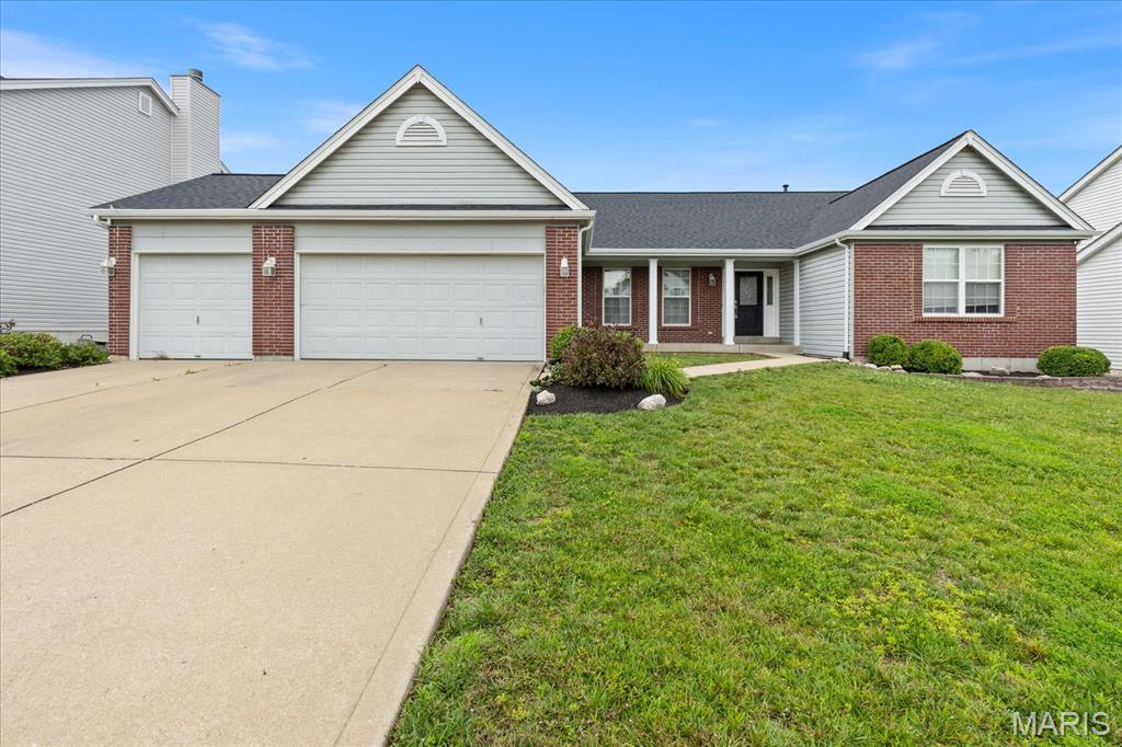 Welcome home to this beautifully maintained split-bedroom ranch offering comfort and space.  The spacious primary suite serves as a private retreat, featuring walk-in closets, dual vanities, a relaxing soaking tub, and a separate shower. Two additional bedrooms are complemented by a versatile bonus room, perfect for a home office, study, or flex space. A welcoming entryway opens to an inviting floor plan designed for both everyday living and entertaining. Enjoy a formal dining room, a cozy living room with a fireplace, and a well-appointed kitchen featuring a pantry and breakfast bar. Additional highlights include hardwood flooring, ceramic tile, vaulted ceilings, ceiling fans, central air conditioning, and a spacious 3-car garage with a dedicated workshop area. The main-level laundry room adds convenience, while the large unfinished basement offers endless possibilities for storage or future expansion. Step outside to a charming back porch overlooking the fully landscaped yard. Recent updates include fresh interior paint, a new roof, gutters, and downspouts, making this home truly move-in ready. Don't miss the opportunity to make this exceptional property your own!