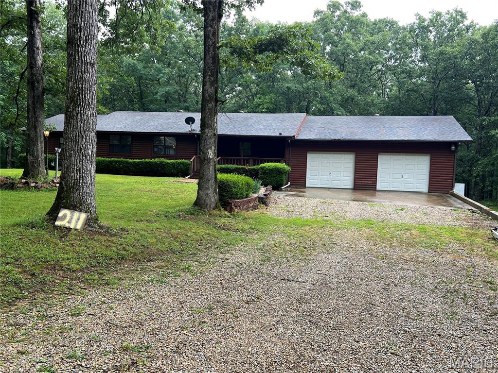 Tucked away on 15 beautiful acres just minutes from Lake Wappapello, this custom log home offers the perfect blend of privacy, space, and opportunity. Whether you’re looking for a full-time residence, weekend getaway, or potential short-term rental, this property delivers the lifestyle buyers are searching for. Surrounded by nature, the home features over 3,400 sq ft with 4 bedrooms and 3 bathrooms, giving you plenty of room to host family and friends. The warm wood interior, open living spaces, and peaceful setting create that true “cabin retreat” feel. Outside, the possibilities really open up, ample acreage for recreation, hunting, or simply enjoying the quiet. The shop building and RV storage add even more flexibility for outdoor enthusiasts or those needing extra space for equipment and toys. Properties like this don’t come along often in this area—especially with this much land and usability so close to the lake. If you’ve been looking for a private escape with room to breathe, this is one you’ll want to experience in person. Seller says bring offers!