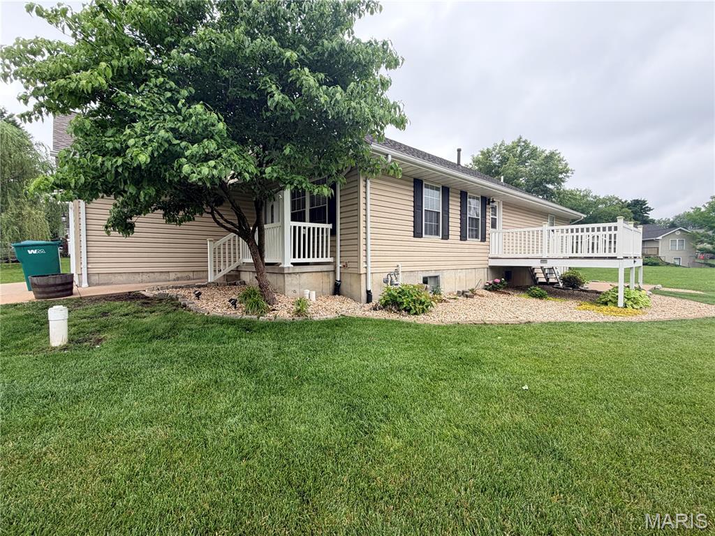 Adorable ranch-style home featuring a covered front porch, 2 car attached garage, and a spacious yard perfect for outdoor enjoyment. Step inside to find beautiful hardwood floors throughout the main level and an inviting living room with access to the side deck — ideal for relaxing or entertaining. The updated kitchen offers newer stainless-steel appliances, new garbage disposal, and stunning oak cabinetry with plenty of storage space. The oversized master suite includes a large walk-in closet, an additional spacious closet, and a private full bath with double sinks. Main level also features two additional bedrooms with hardwood flooring and large closets, a second full bathroom, and convenient main floor laundry located in the hall closet. The full unfinished basement provides endless possibilities to finish and make your own with a blank canvas layout. Basement also includes a half bath, sump pump, and water softener. Major bonus — the home has a brand new roof installed just 2 weeks ago! Don’t miss this well-maintained and move-in ready home!