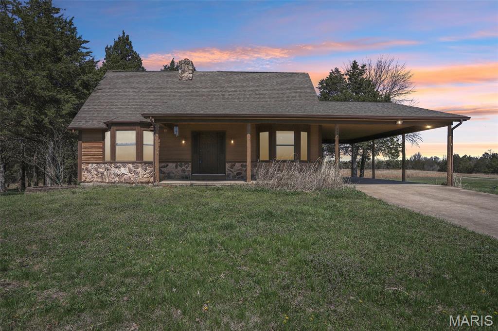 10 acres with pond • Outbuilding with lean-tos • Main floor primary suite • Walk-out lower level

Escape to your own private retreat with this stunning, rustic home on 10 acres with private pond and outbuilding in Jefferson County.  Tucked away in a peaceful, natural setting, this property offers the perfect blend of privacy, space, and everyday functionality. The home has warm character with natural materials, inviting living spaces, and scenic views in every direction.

The main level includes luxury vinyl plank and hardwood flooring, kitchen with large center island and cooktop, main floor laundry, and primary bedroom on main level. Upper-level loft includes a second bedroom with a half bath.

A walk-out lower level with rough-in provides expansion potential for additional living space, recreation room, or storage.

Outdoor features include 10 acres of usable ground for recreation or hobby use, private pond for fishing and outdoor enjoyment, plus deck and 3-season room with views of the water and surrounding acreage. Large outbuilding with lean-tos on both sides supports equipment storage, workshop use, hobby space, or covered parking.

Located in the De Soto area with access to State Road E and Highway 21, connecting to shopping, dining, and services. Nearby outdoor recreation includes Washington State Park and local parks and trails. 

Property supports searches for homes with acreage, pond, outbuilding, workshop space, main floor living, and hobby farm potential.

Nearby Amenity List (Geo-Optimized)
Washington State Park 
De Soto city center 
State Route 21 access
Local grocery, retail, dining and coffee