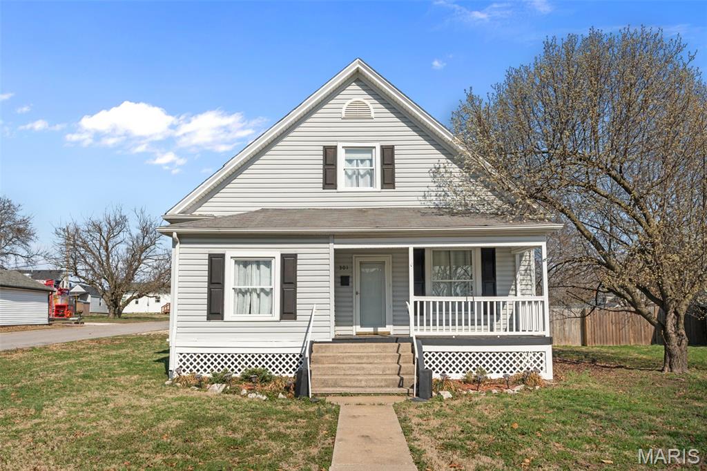 This 3-bedroom, 1.5-bath home in the heart of Wentzville has the classic 1.5-story farmhouse style and covered front porch that give it a charm and character you simply do not find in new construction. Built in 1940 with 1,793 square feet, there is real space here waiting to be unlocked. The detached garage and wood deck give you more to work with than most comparables in this range. Bring your vision and your tools — this one rewards the buyer willing to put in the work and make it their own. Priced to move in one of the most in-demand zip codes in the St. Louis metro, Wentzville R-IV school district, and walking distance to Heritage Elementary. Downtown Wentzville, Hwy 70 access, and all the growth this corridor has seen make this location as solid as it gets for the price.