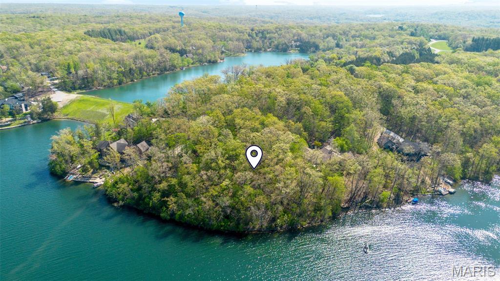 This is your chance for a rare opportunity to build on the shores of prestigious Lake Alpine, one of Innsbrook’s most coveted lakes. This beautiful 1.77-acre wooded homesite offers over 225 feet of lake frontage, incredible southwest-facing water views, and a gentle slope with ideal topography for a custom lakefront retreat. Tucked into a quiet cul-de-sac near the Konstanz gate, the setting offers both privacy and easy access in and out of the resort. Surrounded by established luxury homes while still feeling private and natural, this exceptional lot provides the space and setting to design a home that captures the lake, trees, and sunset views. A private lakefront dock may be added, creating the full Lake Alpine lifestyle for boating, swimming, relaxing, and entertaining. With no required timeline to build, the next owner can secure a premier lakefront property now and create their vision when the time is right.