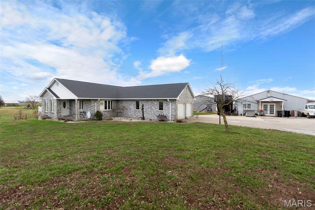 This isn't just a home, it's a lifestyle. Nestled on 9 acres in Perry County, this custom all-brick ranch has been built and finished to a standard you won't find at this price anywhere else in SE Missouri. Step inside to handcrafted custom cabinetry and rich woodwork throughout. Head downstairs to the finished walkout basement with a full bar,  it opens directly to the in-ground pool and composite deck, making entertaining effortless. Outside: a serene pond stocked with bluegill and bass, a cabana, and a 4,800 sq ft shop with heated floors and a mechanic's pit. The property even has its own internet tower providing free internet service. Whether you're a car enthusiast, a hobbyist, someone who loves to entertain, or simply someone who wants true privacy without sacrificing quality, this is it. Properties like this don't come around twice. Only 29 Minutes to P&G and 14 minutes to TG USA.