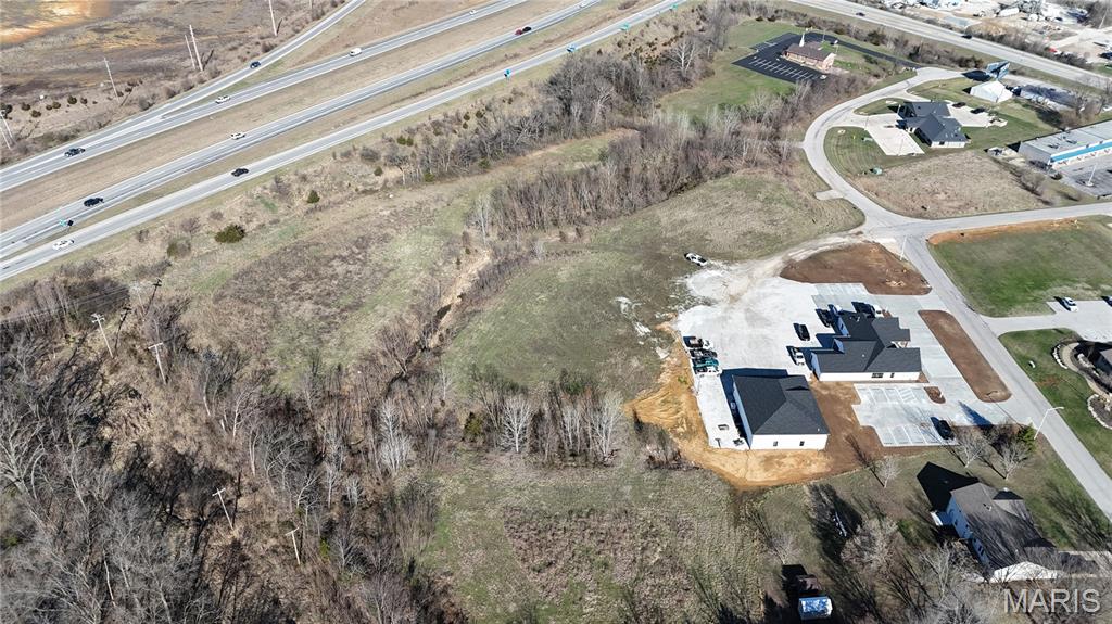 Excellent opportunity to own 2.03+/- acres (Lot 3) of commercial land in Moscow Mills. Located within a Business Park / Industrial Park setting, this property offers outstanding potential for a wide range of commercial or light industrial uses. The lot provides ample room for building, parking, and operational space, while still allowing flexibility for future expansion. Its convenient location offers easy access to major roadways and nearby communities, making it an attractive option for businesses looking to establish or expand their operations. With ongoing growth and development in the Moscow Mills area, this property presents a great investment opportunity for developers, business owners, or investors seeking commercial land in a thriving location.