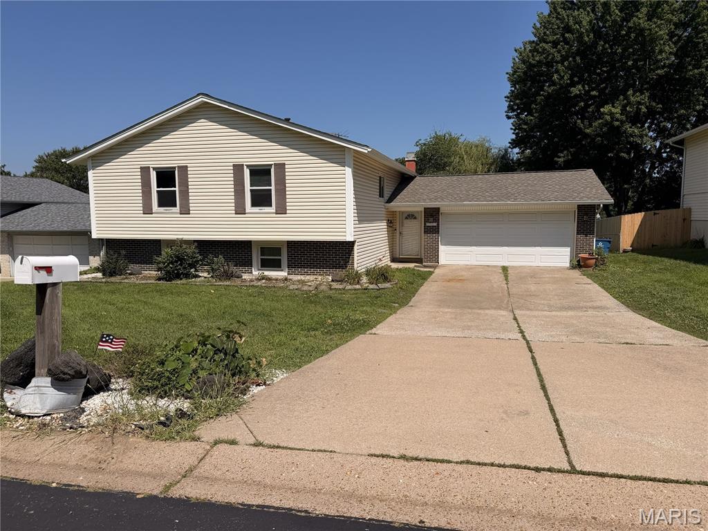 Great investment opportunity!  This spacious split-level home with 4 bedrooms and 3 baths is poised well for investors and families alike.  With light aesthetic work, this nice home will shine once again and serve new owners well.  A huge upper-level living room greets you upon entry, or cozy up in the lower-level living room next to the wood-burning fireplace.  The flooring is newer, the kitchen has been updated, and the lower level is nicely finished, offering an extra-large laundry room.  The custom bookcases and cabinetry throughout the house add a nice touch as well.  It won't take much to get this home back to optimal condition.  Call today or make your showing appointment now before this opportunity is gone!