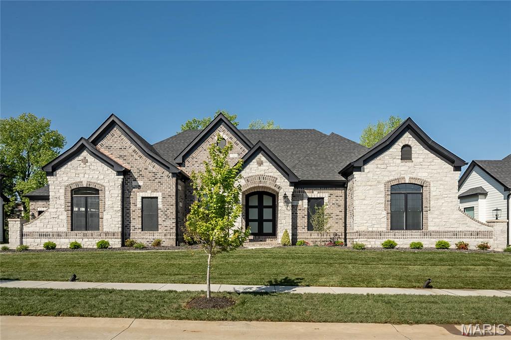 New Construction! FABULOUS LOCATION! Crafted by St. Louis' premier hands-on builder, Claymont Development, LLC - Wesley Byrne. The KELLY Ranch is a spectacular 4BR, 3.5 bath with approximately 3,500 sqft at the main floor and an additional 1,800 sqft at finished Lower Level. Stunning brick and stone front elevation European architecture. Gourmet kitchen with custom cabinets, stainless steel appliances & granite. Vaulted Hearth Room is the perfect place to relax & unwind. Formal Dining Room, Office off of the Luxury owner's suite with walk in closet. MF bedrooms w/ J&J bath. Sensational Lower Level includes brick/stone wet bar, huge rec-room and 4th bedroom with full bath. Four-car side entry garage. Build your Dream home TODAY! Pictures are of a Previously Built Home (Kelly Model) & Tour is of the Display Home (Wingate Model).