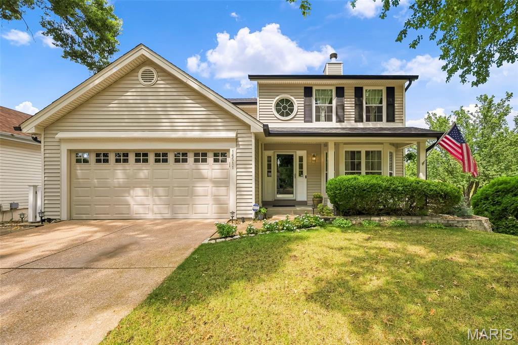 This beautifully updated and lovingly maintained home nestled in the Villages of Cherry Hills in the enclave of Hunters Crossing is a must see! The main level features a 2-story entry with custom millwork and stairway and opens to an inviting living room with a wood burning fireplace accented by a custom mantel and marble surround plus a bay window overlooking the front yard. Entertain your family and friends in the separate formal dining with extensive millwork adding character and charm. The spacious kitchen and breakfast room welcomes you with 42" white cabinetry, quartz countertops, large undermount sink, pull-out shelving, stainless appliances, peninsula with custom marble detail, wine rack and pantry. A half bath tops off the main level with crown molding, fluted casing and ceramic tile floors. Upstairs you'll find the primary bedroom to be a relaxing retreat complete with a vaulted ceiling, ceiling fan, two slider closets with custom built-ins and LVP flooring, and a gorgeous primary bath featuring a custom marble shower, adult height vanity with quartz top, marble flooring, and newer toilet. Two additional bedrooms with slider closets and neutral decor share a hall bath with a tub/shower combo including Jacuzzi tub, venetian tile, adult height vanity with granite top, and a newer toilet. The partially finished walk-out lower level offers amazing extra living space to use as you choose! The unfinished area includes laundry hookups and built-in shelving for storage. Fabulous two-car garage is one of a kind and not to be missed boasting cedar paneled walls with a pine tongue and groove coffered ceiling, recessed lighting, and an updated garage door with locking system! This custom garage is heated and features a ceramic tile perimeter designed to hold storage units and other great features. Cabinet with sink inside will remain with home. Additional cabinets and car washing station may be negotiable at the right price. Enjoy the outdoors as the bay window sliding door from the breakfast room conveniently leads to a composite deck overlooking the beautifully landscaped backyard with white vinyl privacy fencing, arborvitae surround and aggregate patio off walk-out lower level. New gutters and soffit and fascia, and vinyl siding with fiberglass reinforcement! Alarm system with interior and exterior cameras. Exterior cameras to remain with home, owner will be taking interior cameras. All mounted TVs  and sound system in lower level and garage to remain with home. Additional bonuses include irrigation system, Low-E double hung tilt-in windows with transferable lifetime warranty and Low-E doors, high pressure washing station on side of home, and a timer switch for front and back lights. Close proximity to neighborhood amenities (clubhouse, pool, playground, tennis courts) and additional parking! Just minutes from Wildwood Town Center, shopping, restaurants, parks and award winning Rockwood schools! Catch it while you can!