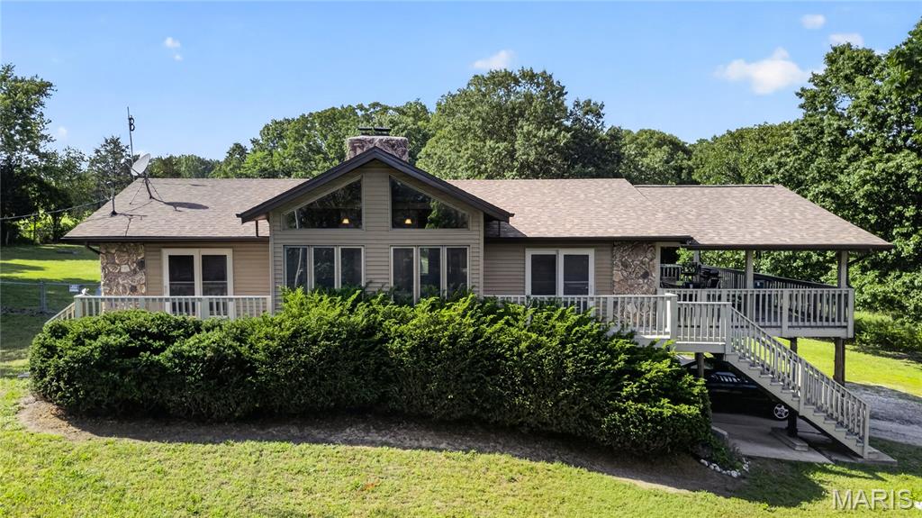 Set on 13+/- acres, this inviting 3-bedroom, 3-bath home offers the perfect blend of comfort, versatility, and exceptional outdoor amenities. The split-bedroom floor plan provides privacy, while the 1,659+/- square feet of main-level living space is enhanced by expansive south-facing windows that fill the home with natural light and a striking stone wood-burning fireplace that anchors the living area. Built with durable 2x6 exterior construction and designed for accessibility, the home delivers both quality and convenience. Roof and gutters were replaced in 2024.
Outside, the property is designed for enjoying every season. Relax by the inground pool, host effortlessly on the large covered deck, and enjoy direct deck access from both the primary and second bedrooms. The impressive 40x80 pole barn with concrete flooring and electricity adds incredible flexibility for equipment storage, hobby farming, workshop space, or equestrian use. A lower level with an existing bath offers even more potential for future living space, while electric and wood heat provide efficiency and choice. All of this is tucked away in a peaceful setting just 2.5 miles from Hwy 21/B, offering the best of privacy and accessibility.  SHOWINGS BEGIN FRIDAY 6/5.