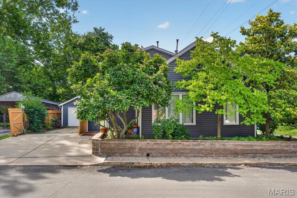REMODELED in 2001-2002 original house down to studs then new 200 AMP electrical, plumbing, sewer to street, insulation, casement windows and so much more! Zoned HVAC. Whole house water filtration. Kitchen has an abundance of cabinets & pantry. Most of main floor has (2002) ¾ inch oak flooring. Main floor laundry with LG washer & dryer – 2007. Enjoy the open floor plan with very large living room leading to dining area and kitchen with long bar welcoming many people. Double pane tinted windows installed 2021. Roof, siding and 2 garage doors – 2024. There is one bedroom on main and 2-primary en-suites with walk-in closets upstairs and 4th bedroom! Wait until you see the spacious family room upstairs. There’s a non-conforming 5th bedroom (window not large enough). This location has so much opportunity for you to use space ideal for you. The backyard offers great privacy with a board fence.  Sellers are offering a 1-year Guard Home Warranty-$649.00 and $2,000.00 paint allowance. Don’t miss this opportunity to have a large house in the “Original Town of Edwardsville” just one block off N Main Street! You can walk to restaurants, Wildey Theater, Edwardsville Art Center, Goshen Market, Library and Madison County buildings! Call your favorite realtor to make an appointment today!