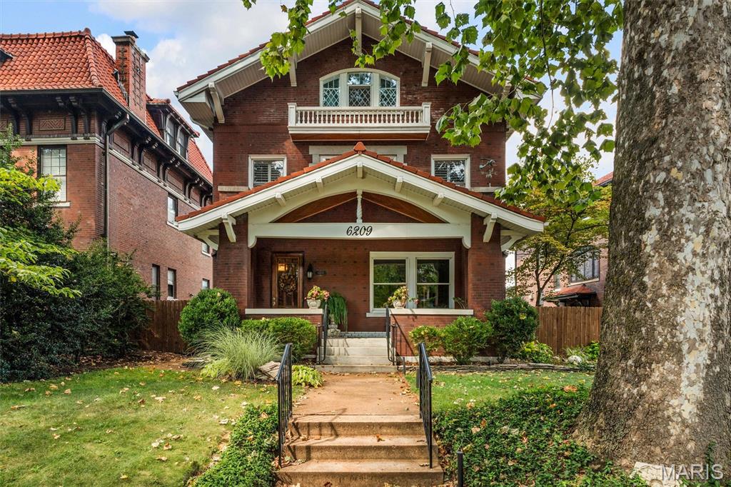 Don’t miss this elegant 5-bedroom, 3-story Parkview home with its beautiful 1909 architectural details: a welcoming entryway featuring a magnificent stained glass window, exposed brick wall, gleaming hardwood floors, original woodwork, and a fabulous flow for entertaining.  Large living room with gas fireplace leads to a library, dining room, eat-in kitchen and 1/2 bath.  The kitchen boasts large maple cabinets and granite countertops that provide ample storage and work space. The family/bonus room off of kitchen has another gas fireplace and an entrance to the fenced back yard with a large wrap around deck.  The landscaped yard features mature plantings and a magnificent water feature that provides year round enjoyment. Several stained glass windows adorn the second floor.   Here you’ll find a primary suite with a renovated en-suite bath and walk-in closet, two more large bedrooms and an updated hall bath with second-floor laundry closet hookups.  The third floor offers even more flexibility with two additional bedrooms, lots of storage and a full bath—perfect for guests or a private home office.  The basement is partially finished and can be used as another recreational space, playroom or work-out room.  It has a 1/2 bath, laundry area and built-in shelving.  Current homeowners have lovingly maintained the home for over 40 years with kitchen, baths, and systems upgrades, including the addition of zoned heating and a new roof in 2018. Parkview is known as an "urban oasis" with its curving tree-lined streets, parks, and neighborhood seasonal events, (concerts, winter carriage rides, cook-offs, food trucks, Easter egg hunts and a petting zoo).  This vibrant community is within walking distance of Washington University, Forest Park, popular restaurants, shops, and two MetroLink stations. Parkview is on the National Historic registry. See website for Indentures, neighborhood info, occupancy (single family only) http://www.parkviewneighborhood.org/new-residents, and renovation restrictions.