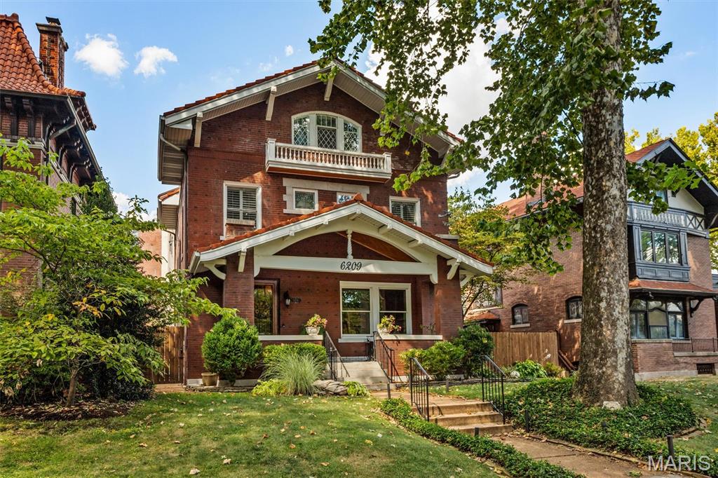 Don’t miss this elegant 5-bedroom, 3-story Parkview home with its beautiful 1909 architectural details: a welcoming entryway featuring a magnificent stained glass window, exposed brick wall, gleaming hardwood floors, original woodwork, and a fabulous flow for entertaining.  Large living room with gas fireplace leads to a library, dining room, eat-in kitchen and 1/2 bath.  The kitchen boasts large maple cabinets and granite countertops that provide ample storage and work space. The family/bonus room off of kitchen has another gas fireplace and an entrance to the fenced back yard with a large wrap around deck.  The landscaped yard features mature plantings and a magnificent water feature that provides year round enjoyment. Several stained glass windows adorn the second floor.   Here you’ll find a primary suite with a renovated en-suite bath and walk-in closet, two more large bedrooms and an updated hall bath with second-floor laundry closet hookups.  The third floor offers even more flexibility with two additional bedrooms, lots of storage and a full bath—perfect for guests or a private home office.  The basement is partially finished and can be used as another recreational space, playroom or work-out room.  It has a 1/2 bath, laundry area and built-in shelving.  Current homeowners have lovingly maintained the home for over 40 years with kitchen, baths, and systems upgrades, including the addition of zoned heating and a new roof in 2018. Parkview is known as an "urban oasis" with its curving tree-lined streets, parks, and neighborhood seasonal events, (concerts, winter carriage rides, cook-offs, food trucks, Easter egg hunts and a petting zoo).  This vibrant community is within walking distance of Washington University, Forest Park, popular restaurants, shops, and two MetroLink stations. Parkview is on the National Historic registry. See website for Indentures, neighborhood info, occupancy (single family only) http://www.parkviewneighborhood.org/new-residents, and renovation restrictions.