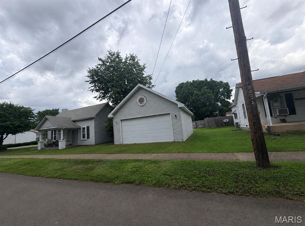 A great opportunity for investors! Cozy 2 bedroom, 1 bath home featuring a welcoming covered front porch and a spacious 2 car detached garage. This property offers comfortable living with great curb appeal and plenty of storage or workshop space in the detached garage. Enjoy relaxing mornings on the front porch and the convenience of extra parking and storage.
