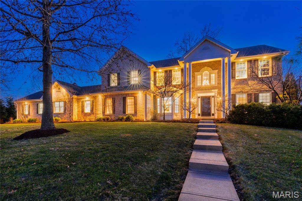 A real class act. This custom-built 5-bed/5-bath residence wrote the book on good looking livability, boasting bright open spaces with 9-ft ceilings and everything on your wish list. Well-heeled living room and dining room (with stunning wainscoting and millwork) flank impressive two-story entry boasting a t-staircase. Handsome wide-plank wood floors, luscious clean paint palette, newer Renewal by Anderson (sound buffering) windows and doors to let the sunshine in. Culinary aficionados will applaud gourmet kitchen boasting gorgeous cabinetry and granite surfaces, plus a large island for prep work, Sub-Zero fridge, Cafe Convection range, two Asko dishwashers and remote-control window coverings. Breakfast room allows casual dining room within the kitchen, and a butler's area with glass front cabinetry and wet bar makes serving a group a breeze. Hearth room hosts wood-burning fireplace and provides direct access to outdoor deck. Revamped and expanded great room also features custom cabinetry, Sub-Zero fridge, wine storage and cooling drawers.  Absolutely show-stopping outdoor area for relaxing and entertaining touts huge covered deck with vaulted tongue-groove ceiling, skylights, recessed lighting, fans, heaters, a propane fire-pit, a grill station, plus a second patio. Back inside and upstairs, a comfy loft area invites you to gather, or create a study area for the kids. Four bedrooms line the loft/landing including a generously-sized vaulted primary suite with two walk-in closets, dual sink vanity, separate tub/shower and stain glass picture window. A Jack & Jill bath adjoins two of the bedrooms, one with built-in bookcases and large closet, the other with a walk-in closet.  Another full bath and 4th bedroom (w/walk-in closet) complete this level. Heading to the lower level, you'll find a large recreation space with egress window, kitchenette and full bath with a dual Hollywood-style vanity (and also utility/storage room with built-in shelving.)  You'll be charmed by the cupola perched proudly atop three-car garage with stylish carriage-style doors. (A separate storage room, wheelchair lift, shelving and cabinets to boot.)  An extra parking pad for guests and black iron gated /fenced yard for your four-legged friends. Visionary owner had renowned architect (who spear-headed the home's 2019 expansion for the previous owner) create additional plans for main floor primary suite conversion should you be so inclined. (5th main floor bedroom with built-ins being used as an office currently). Entire home has been freshly painted in luscious creamy colors, brand new neutral plush carpeting upstairs, professionally-cleaned top to bottom, inside and out including sparkling windows. Exceptional Offering. Welcome Home!