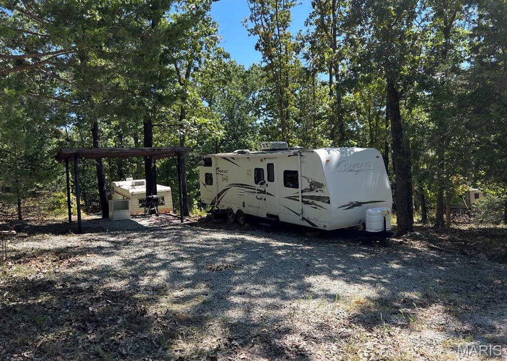 Beautiful lot with electric already available and a camper included! Enjoy convenient Goose Creek access, perfect for relaxing, camping, fishing, and enjoying the outdoors. A great spot for a weekend getaway or your own recreational retreat!