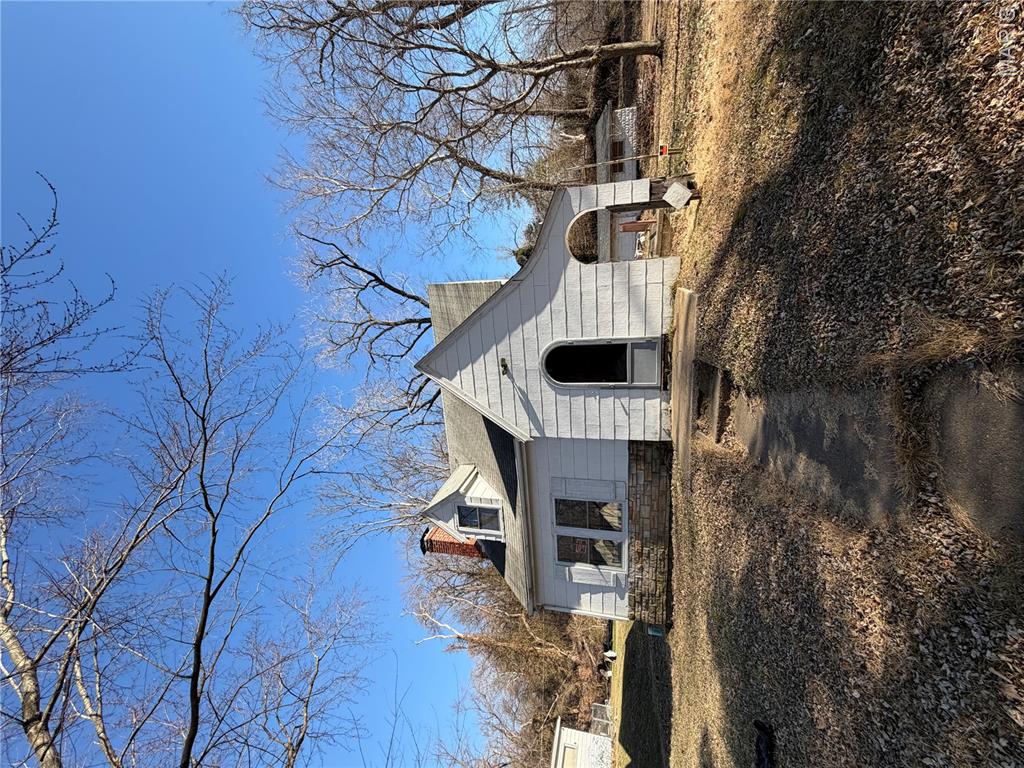 Great opportunity to own or invest in this 2-bedroom, 1-bathroom home on 0.37 acres, with a detached workshop that could potentially serve as a one-car garage. The property features original hardwood floors in the living room, dining room, and bedrooms. There's also an unfinished basement that offers potential for storage or expansion. Conveniently located near amenities and commuter routes. Property is being sold in As-Is Condition. Buyers and buyer's agent to verify all MLS information.