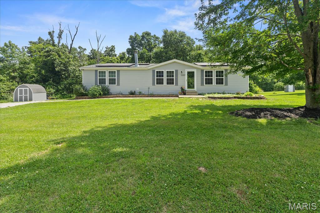 Imagine waking up to peaceful wooded views on your own 1.92-acre retreat! This beautiful 3-bedroom home offers a bright, open layout perfect for entertaining. The heart of the home is the huge eat-in kitchen, outfitted with a center island and a pantry. Main-level laundry adds total convenience, while the primary suite offers a luxurious escape with vaulted ceilings, a walk-in closet, and a beautiful bath complete with double sinks and a separate tub and shower. Sip your morning coffee in total privacy with nothing but woods behind you!