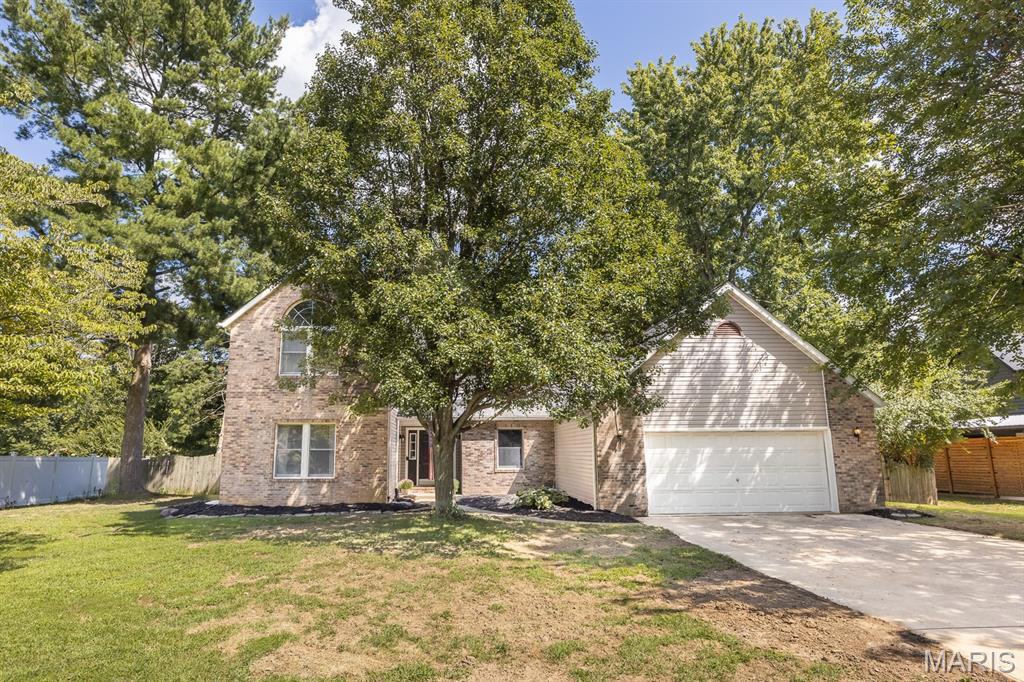 Tucked away on a spacious cul-de-sac lot, this two-story home offers 5 bedrooms, 3 full bathrooms, an inground pool, and an abundance of living and entertaining space inside and out! A large front yard and fresh landscaping welcome you into a home filled with character, including original hardwood floors and an open layout connecting the kitchen, breakfast area, and impressive two-story family room. Skylights, a wood-plank ceiling, bay window, built-in shelving, and a wood-burning fireplace make this space truly stand out.

The main level offers exceptional flexibility with an oversized office featuring glass French doors that could also serve as a formal living room or additional flex space, a separate dining room, main-level bedroom, full bathroom, and laundry room. The kitchen features stainless steel appliances, while updated LVP flooring extends through the garage entry, laundry, and bath areas.

Upstairs, the spacious primary suite features vaulted ceilings, a walk-in closet, built-in makeup/vanity area, and private bath with dual sinks and a skylight. 2 additional bedrooms and another full bathroom complete the second level.

The completely refinished lower level adds even more usable living space with LVP flooring, a large family/rec room, extra bonus space, and 5th bedroom.

Step outside to a backyard made for entertaining! A wraparound wood deck overlooks the inground swimming pool, privacy-fenced yard, mature trees, and fire pit area, with plenty of room to gather, relax, and enjoy the outdoors.

With its generous room sizes, flexible floor plan, distinctive architectural details, large lot, and backyard amenities, this home offers so much potential. Bring your personal touches and a little TLC to make this spacious property your own!