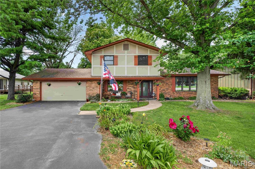Welcome home to this beautifully maintained 2-story residence offering a functional and inviting floor plan with 3 spacious bedrooms, 2 full bathrooms, and a convenient main-level half bath. The main floor is designed for comfortable everyday living and effortless entertaining, featuring a formal living room, formal dining room, a spacious family room with a cozy brick fireplace, and an updated kitchen with granite countertops, stainless steel appliances, tile backsplash, and a bright breakfast area. A main-floor laundry room adds everyday convenience. Upstairs, you'll find a generous primary suite with a private bath, along with two additional bedrooms and a second full bathroom, providing plenty of space for family, guests, or a home office.
Outside, enjoy outstanding curb appeal with mature shade trees, professional landscaping, a covered front porch, a large asphalt driveway, and an attached 2-car garage. The backyard offers a patio and plenty of green space for relaxing, entertaining, or outdoor activities. Situated on a level 0.23-acre lot, this home is conveniently located near shopping, dining, schools, parks, and major roadways, making commuting and daily errands a breeze. Don't miss the opportunity to make this charming Belleville home your own. Schedule your private showing today!