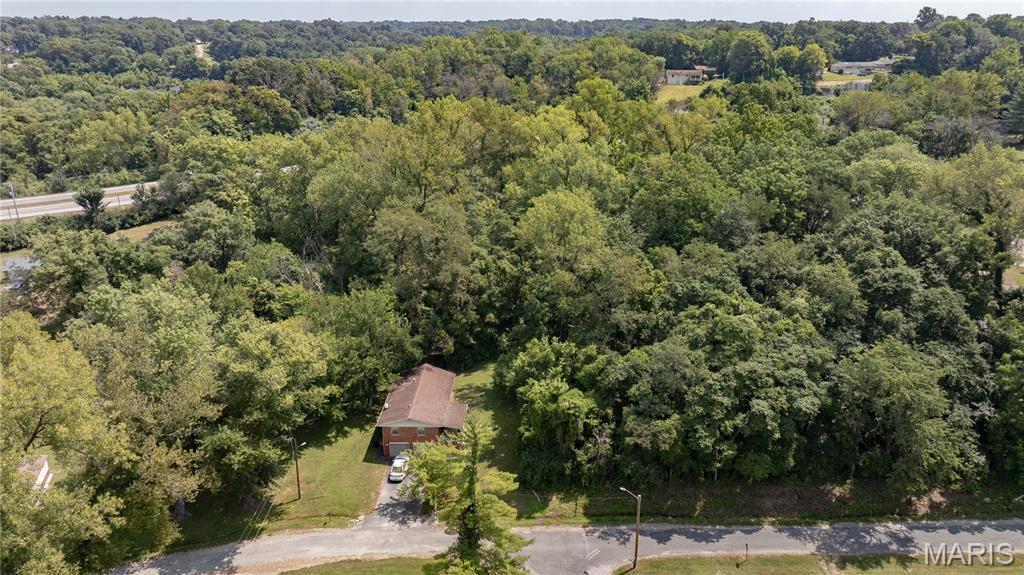 Don't miss out on this unique 0.61+/- acre lot offering a mostly wooded, terraced setting. Conveniently located, this property provides the perfect blend of privacy and accessibility. Consisting of 3 parcels, the mature trees and terraced terrain offer multiple levels for creative building or landscaping opportunities. Picture your private home nestled amongst the trees. This lot has it all; space, beauty, and location, what more could you ask for?