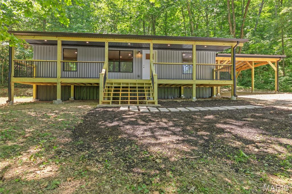 **OMG... Becky, look at the size of that deck!** ??

Now that we've got your attention...

This completely rebuilt 3-bedroom, 2-bath home sits on **over 10 beautiful acres** and is ready for you to enjoy! Step inside to an open floor plan featuring granite countertops, stainless steel appliances, and modern finishes throughout. Outside is where this property really shines. Relax on the massive covered deck overlooking your private acreage, park all your vehicles under the oversized covered parking area, and bring the horses—there's a barn and plenty of room for them to roam!

If you've been searching for a move-in-ready home with acreage, privacy, and space to live the country lifestyle, this one check all the boxes.  Schedule your private tour today.