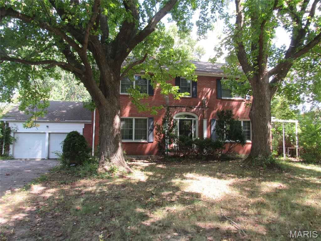 Spacious & Charming describe this fixer-upper property with endless possibilities! This is your chance to own a large brick stately home on 2+ acres. It's a beautiful 4 bed, 3 bath all-brick two-story home nestled in the heart of Elsberry. This home has a unique floorplan and features wood floors throughout the main level, a cozy fireplace in the living room, and a lovely sunroom to soak in the views. This stunning property is perfect for someone wanting to make it their own.  With an amazing location and a spacious floor plan this home is a rare find. Property is being sold as-is. Seller will not make any repairs. This property may qualify for Seller Financing (Vendee). If property was built prior to 1978, Lead Based Paint Potentially Exists.