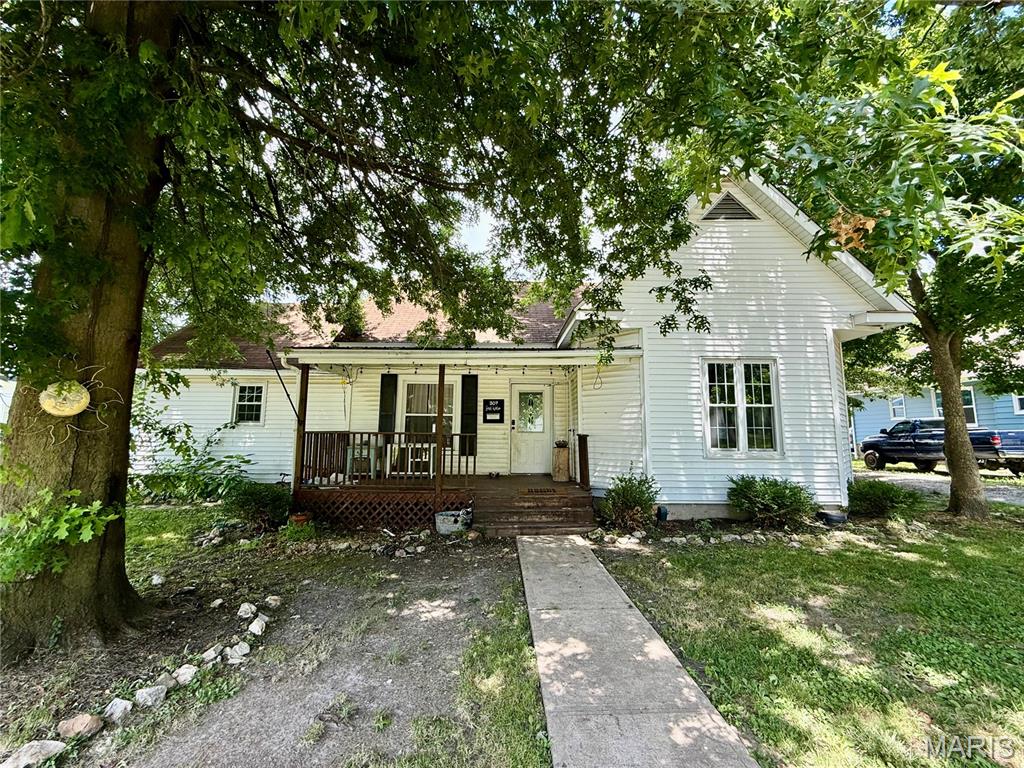 COMING SOON! Showings start July 1st! 
3 bedroom, 1 full bath home with 32x28 detached garage! Covered front porch and huge rear deck to enjoy.  Large soaking tub in bathroom. Nice kitchen with updated cabinets and tops with pantry. 7x15 mudroom and laundry room off of the kitchen with lots of built-in cabinets. All kitchen appliances convey. Separate dining just off the kitchen and front living room. Private master bedroom towards the front of the home. Great layout with the other 2 bedrooms on the other side of the home. Call to take a look!