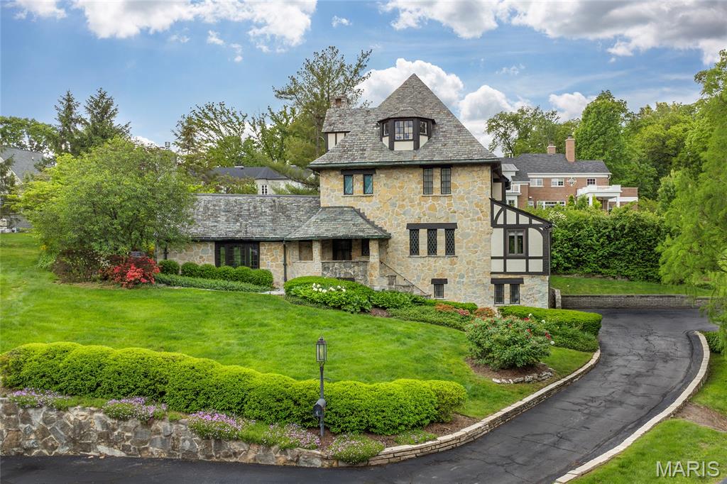 Back on Market - No Fault of Seller! Incredibly charming 3-Story home, with stone facade, situated on a beautiful .32-acre lot in the desirable Glen Forest Subdivision. 3 Beds, 4.5 Baths & 3200+ sqft of living space including the finished Lower Level! Main Floor features an Entry Foyer with gorgeous millwork, which can be found throughout the home; Living Room with hand hewn beamed ceiling, large windows & French doors leading to the stone patio. Formal Dining Room, eat-in Kitchen, with Rutt custom cabinetry, marble counters & backsplash, farmhouse sink, travertine floors & top of the line appliances, including Wolf & Subzero. Vaulted Family Room with large bay window/built-in bench & wet bar. Handcrafted staircase to the 2nd Floor, Primary Suite with luxury Bath with double vanity/marble top & several closets. Finished 3rd Floor, complete with the 3rd Bed & 3rd Bath! Wood floors, leaded glass windows & period moldings! Relax outside on the stone, backyard patio, with fire pit area, in your own peaceful oasis.