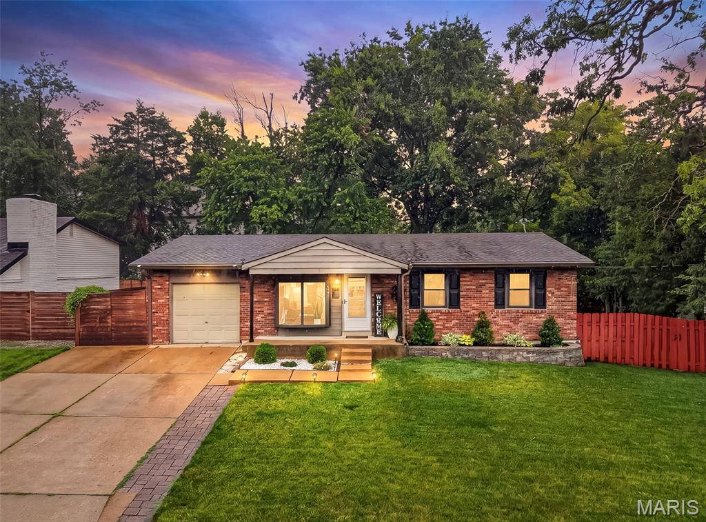 Welcome to 347 Lillian Ave, just steps from Fillmore Park! A charming 3 bedroom, 2.5 bath ranch home in the highly rated Kirkwood School District on a corner lot with over 1,800sf of living space! Step inside to discover a welcoming layout filled with natural light and comfortable living spaces. The functional kitchen offers abundant cabinetry and storage, complete with a gas range, built-in microwave, and stainless steel refrigerator. Just beyond, the bright sun porch opens to a generous, tree-lined backyard with deck, an ideal setting for morning coffee, gatherings, or peaceful evenings outdoors. The main level features 3 bedrooms, a full hall bath and primary half bath. The finished lower level includes a full bath and versatile space with a large rec room, an office or sleeping area, and ample storage. Oversized attached one-car garage with a two-car driveway, offering ample off-street parking. Nestled in a prime neighborhood with easy access to parks, the vibrant downtown Kirkwood, and major commuting routes, this home provides the perfect blend of convenience and everyday comfort. A wonderful opportunity for buyers seeking a solid home with strong bones in a top location.