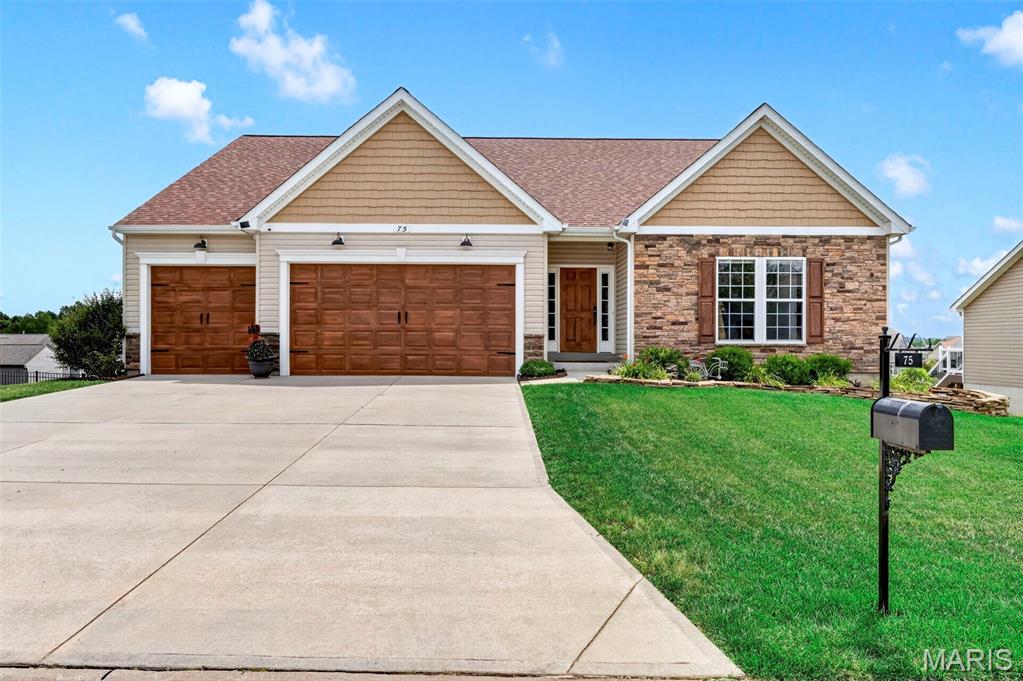 COMING SOON – BETTER THAN NEW!
Why wait months to build when you can own this stunning, move-in-ready ranch loaded with custom upgrades that today’s buyers dream about? Every detail has already been completed, from the premium finishes inside to the incredible outdoor living spaces, saving you the time, expense, and stress of building new.
Offering 3 bedrooms, 2 bathrooms, 2,160 square feet, and an oversized 3-car garage, this exceptional home combines luxury, comfort, and functionality in one beautifully designed package.
From the moment you arrive, you’ll be impressed by the striking curb appeal featuring an upgraded Canterbury elevation with beautiful stone and board-and-batten siding, a custom-painted cedar front door, custom-painted garage doors, a brand-new roof, professionally designed landscaping, and a fully fenced backyard.
Step inside and discover soaring vaulted ceilings, luxury vinyl plank flooring throughout, plantation shutters, upgraded custom lighting, built-in surround sound, and an open-concept floor plan designed for both entertaining and everyday living.
The chef’s kitchen is truly the centerpiece of the home, showcasing an impressive 10-foot center island, granite countertops, 42-inch cabinetry, chef-quality appliances, a five-burner gas cooktop, and abundant prep and storage space. Just off the kitchen, you’ll find a beautifully designed custom Butler’s pantry and coffee bar, along with an oversized walk-in pantry featuring a second full-size four-door French door refrigerator—an incredible convenience for entertaining, holiday gatherings, meal prep, and extra storage.
The spacious primary suite offers the perfect retreat with a luxurious spa-inspired bathroom designed for relaxation. The expanded laundry room has also been thoughtfully upgraded with custom cabinetry and a built-in folding station, adding both beauty and functionality.
Downstairs, the deep-pour walkout basement with rough-in plumbing provides endless opportunities to create additional bedrooms, a recreation room, home gym, theater, or guest suite while adding significant future value.
Step outside and enjoy your own private backyard retreat. Large deck overlooks a large covered patio below, creating multiple outdoor entertaining spaces perfect for family gatherings, cookouts, or simply relaxing in your beautifully landscaped backyard.
What truly separates this home from new construction is everything that’s already been completed for you. No additional expenses. No waiting on contractors. Gorgeous landscaping projects. Custom fencing. Treated deck. All window treatments. lighting upgrades. security system installed. It’s all here and ready to enjoy from day one.
Additional premium features include:• Oversized 3-car garage with oversized garage doors• Luxury Vinyl Plank flooring throughout• Vaulted ceilings• Plantation shutters• Custom lighting throughout• Built-in surround sound speakers• Exterior security camera system• Butler’s pantry and coffee bar• Oversized walk-in pantry with second full-size French door refrigerator• Expanded laundry room with custom cabinetry and folding station• Deep-pour walkout basement with rough-in plumbing• large deck off breakfast room with steps to yard• Large covered patio from walk out lower level• Fully fenced backyard• Professional landscaping• Brick,Stone and board-and-batten elevation• Brand-new roof• Custom-painted cedar front door and shutters Custom-painted garage doors
This home truly delivers the luxury, upgrades, and lifestyle buyers are searching for—all without the wait of new construction.
Better Than New. Move-in Ready. Simply Exceptional.