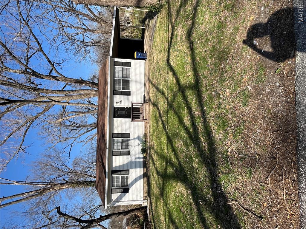 Cozy ranch style home with carport. The exterior is maintenance free with newer vinyl siding and carport. This home has a freshly painted interior, newer light fixtures throughout, updates to bathroom, eat in kitchen and refinished hardwood floors throughout. Turnkey and ready for its new owner! Close to highways and just minutes from Lambert Airport.