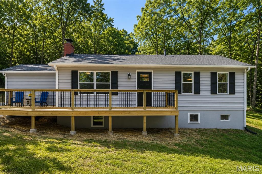 This home truly needs to be experienced in person to appreciate everything it has to offer. Schedule your private showing today—you may be pleasantly surprised, and all reasonable offers will be thoughtfully considered. Completely renovated and thoughtfully reimagined, this 4-bedroom, 3-bath home in De Soto offers the rare opportunity to own a property where nearly everything is new. This is a true restoration—not a surface-level update—completed with a high level of care and attention to detail throughout.

Originally a 3 bed / 2 bath, the home has been expanded to a functional 4 bed / 3 bath layout, including a finished lower level with an added bedroom, full bath, and additional living space. An egress window was installed in the basement despite existing walk-up access, adding both safety and flexibility.

The kitchen has been completely redone with granite countertops, stainless steel appliances, and top-end custom cabinetry, along with new flooring throughout the home. The former laundry area has been converted into a full bathroom/laundry combo for improved functionality.

Major improvements include new windows, new siding, roof, HVAC, drain tile around the foundation, and connection to public sewer with a private well, providing peace of mind that the important systems have been addressed.

Outside, a substantial 750 sq ft wraparound deck extends from the front to the back of the home, including a covered rear patio entrance, creating a standout outdoor living space.

Situated on a generous lot, this home offers space, quality, and a level of renovation that is hard to find. Completed as if it were being kept long-term, this is a true move-in ready opportunity.