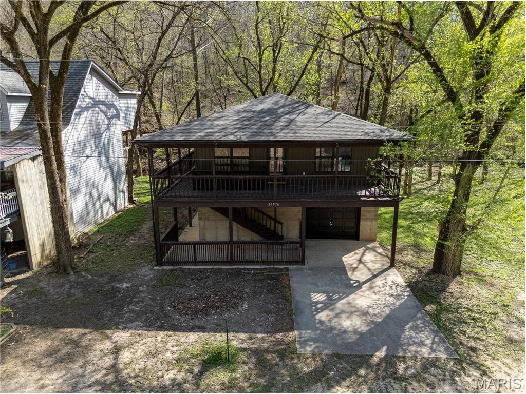 Welcome to your dream river retreat! This beautifully remodeled 3-bed, 2-bath home is just a short walk from the Gasconade River, offering endless opportunities for outdoor adventure, relaxation & recreation. Whether you're an avid angler, kayaking enthusiast or just love the peaceful sound of nature, this location is a rare find. A private concrete community boat ramp is conveniently located just down the street, making river access effortless. Step inside to an open & airy floorplan featuring luxury vinyl plank flooring throughout the home. The kitchen has been thoughtfully updated with white cabinetry, black granite countertops & a spacious center island—perfect for hosting friends and family. The layout flows seamlessly into the living & dining areas, creating a comfortable & functional space for everyday living or weekend getaways. All bedrooms are generously sized & the bathrooms have been tastefully updated to match the home’s modern rustic charm. Outside, the wrap-around porch offers the perfect spot to sip your morning coffee or listen to the gentle babble of the creek that runs behind the property. Surrounded by nature & just moments from the water, this home offers a true escape from the hustle & bustle while still providing all the modern comforts you need. Whether you're looking for a full-time residence or a weekend getaway, this river-close home is a must-see. Don't miss the chance to own a piece of tranquility near the beautiful Gasconade River!