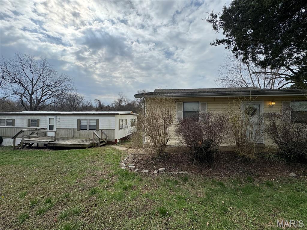 Investor Special on a beautiful piece of land in Hillsboro! THREE BUILDINGS.  Value-Add Opportunity on 5 Acres! Rare opportunity for investors to unlock potential on this unique multi-structure property in Hillsboro. Situated on 5 acres, the property features a single-family home in need of renovation, a nearly rent-ready mobile home (previously rented for $900/month), and a 1,500 sq ft outbuilding/garage offering additional income or use potential. Ideal for rehab, rental portfolio expansion, or multi-use investment strategy. Property is part of an estate and is being sold as-is. Investor buyers only. Bring your vision and explore the possibilities!
