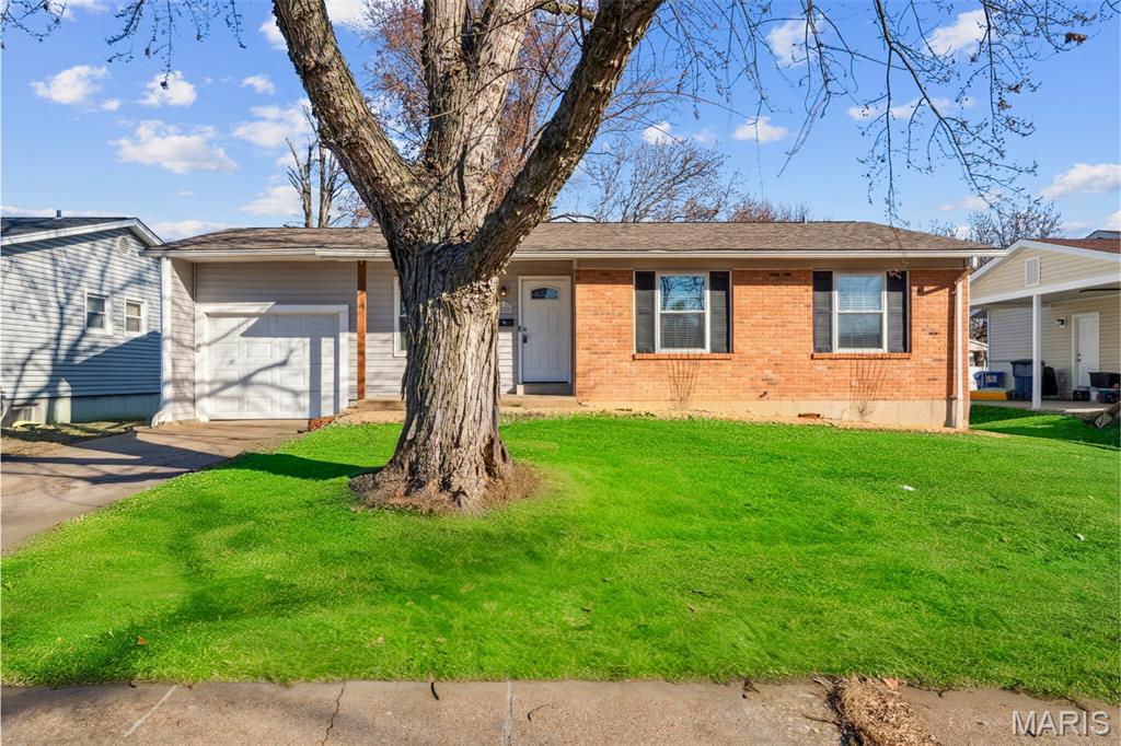 Price Improvement—Now $193,900. Welcome to 435 Lemondale Lane in Florissant, a well-priced, move-in-ready 3-bedroom home that checks the boxes buyers actually care about. Hardwood floors run throughout the main level, including a third bedroom with hardwood and a generous closet because storage should be solved, not negotiated.

The kitchen is functional and updated, featuring a stainless gas range, 48-inch cabinetry, tile backsplash, newer cabinets, garbage disposal, dishwasher, and a real pantry for real groceries. Both bathrooms have been updated, including a refreshed main bath with porcelain tile, newer fixtures, and a newer vanity, along with an updated primary bath area.

Big-ticket items are already handled with windows approximately three years old, a roof approximately five years old, and central air—less fixing, more living. The basement offers more usable space than many comparable homes thanks to an 8-foot pour and includes a sump pump and French drain system, making it practical space you can actually use. The closed-in one-car garage adds flexibility with storage, a smart opener, and room to grow into.

Outside, enjoy a spacious backyard, garden beds, and easy access through sliding doors—ideal for kids, pets, or your first attempt at gardening. Located within walking distance to Saint Ferdinand Park and just minutes from shopping, schools, and everyday conveniences.

Smart updates, strong value, and a layout that works—435 Lemondale is an easy yes for first-time buyers and growing households. Schedule your showing today.