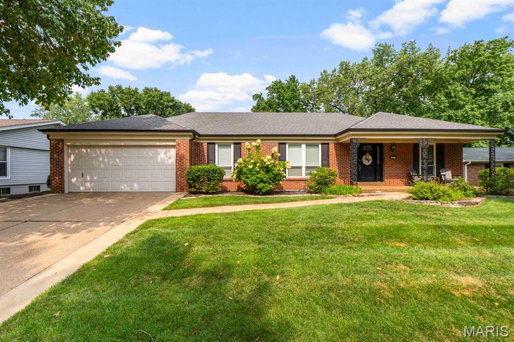 Welcome to this lovely ranch nestled in a fantastic Ballwin subdivision in the Parkway West School District. Set on a spacious lot with a generous rear yard, this home offers wonderful entertaining space along with a convenient, everyday living floor plan. A welcoming front porch leads you inside, where newly refinished hardwood floors flow through the living and dining rooms. Natural light streams through the front windows, creating a bright and inviting atmosphere.

Beyond the living room, the family room features new flooring and freshly painted walls. The kitchen opens to the family room and is conveniently located off the laundry/mudroom. With plenty of counter space and room for an eat-in table, it is designed for both everyday living and easy entertaining. The laundry/mudroom provides convenient access to the attached two-car, front-entry garage.

On the opposite side of the home are three generous bedrooms, each with good closet space, along with two full baths. The spacious primary suite is lovely and light-filled, with views of the rear yard, an ensuite bath, and a walk-in closet. A convenient half bath completes the main level.

The lower level offers endless possibilities! Large and unfinished, it provides a blank canvas to create additional living, recreation, or entertaining areas tailored to your needs.

Out back, the patio overlooking the yard is the perfect spot to relax, dine, or gather with friends and family. The owners have made numerous recent updates to the home, so don't miss the list - Enjoy!