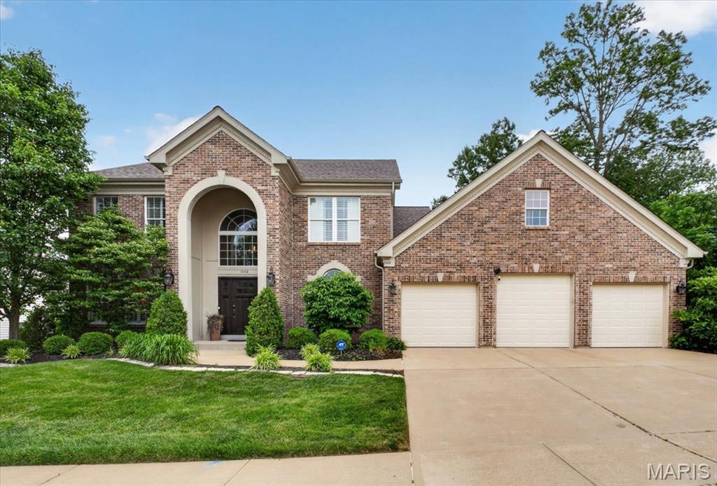 Experience the pinnacle of Chesterfield luxury in this custom 1.5-story masterpiece by Miceli Homes. Nestled in the highly sought after Marquette School District, this home offers over 5,000 square feet of meticulously curated living space. You enter the residence via a dramatic atrium foyer that leads to a main level designed for seamless entertaining. The chef’s kitchen serves as a central hub, featuring a custom-paneled Sub-Zero refrigerator, professional Thermador appliances, granite countertops and an enclosed pantry. A comprehensive 2018 main-floor remodel introduced an enclosed front office and a sophisticated primary retreat boasting a refinished ensuite with a Jacuzzi. Premium upgrades include new hardwood flooring on the main floor and custom wainscoting in the dining room. The light-filled Great Room features soaring tinted windows and for ease of use the gas fireplace was converted to electric in 2018. The adjoining Hearth Room provides access to a spacious deck with views of the rear yard. The redesign of the residence was completed in 2021 with the renovation offers  the basement, which significantly expanded the home’s living space. The lower level now features a hidden theater room, a kitchenette, a full bathroom with shower, a workout room, a spacious fifth bedroom suite and a hobby room that could be used as a sixth bedroom! Recent high-capital improvements provide total peace of mind, including a new roof and garage doors (2025), a stately new front entrance, and a Level 2 EV charger in the three-car garage. With fresh paint on most walls and ceilings and modern conveniences like motion-activated lighting, the residence is move-in ready. Enjoy total peace of mind with an integrated smart security system that offers remote control of the alarm, front door, and garage access—all from the palm of your hand.The home offers the perfect intersection of luxury, smart design, architectural integrity and modern utility.