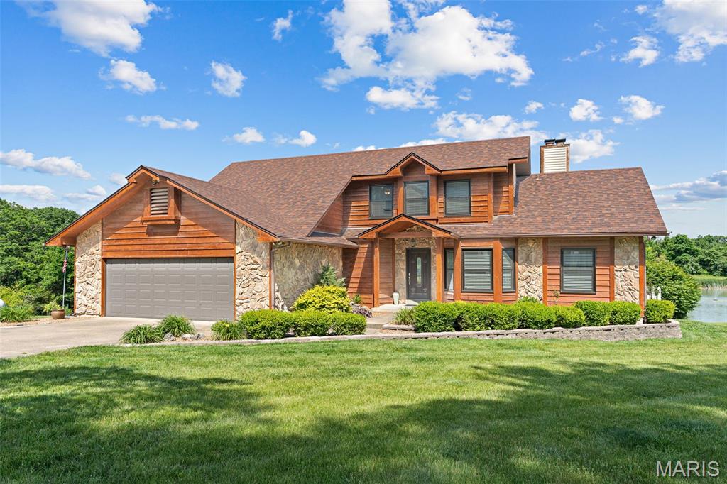 Welcome to your private country retreat in the heart of Warrenton! Nestled on 10.38 unrestricted acres, this stunning 1.5-story estate offers the perfect blend of luxury living, recreation, and peaceful countryside charm.  From the moment you arrive, you’ll be captivated by the breathtaking setting featuring a gorgeous 1.5-acre stocked lake complete with fountain, two docks, and unforgettable sunset views. The backyard oasis is truly resort-style with an inground pool, expansive composite deck, and beautiful outdoor spaces designed for entertaining or simply relaxing in total privacy. Inside, the home showcases an impressive list of updates and custom finishes throughout. The newly remodeled kitchen is a showstopper featuring a massive 8’x4’ island, quartz counter tops, custom cabinetry, walk-in pantry, and stylish finishes ready for the next owner to move right in. The vaulted great room boasts soaring ceilings and a floor-to-ceiling stone fireplace, creating a warm yet dramatic centerpiece for the home. The main-floor primary suite offers comfort and luxury with a jetted soaking tub, oversized walk-in shower, and peaceful views of the property. French doors lead directly to the outdoor living space where you can overlook the pool and lake — famous for producing bass up to 8 pounds!  The finished lower level adds even more living space with a second fireplace, spacious family room, and two separate hobby or flex areas perfect for crafts, fitness, gaming, or a home office setup. Outside, the property continues to impress with a small orchard, garden area, and a cleared additional building site ideal for a future home, guest house, or ADU. The 30x40 detached shop is drywalled and fully functional with two workbenches, a dedicated tool room, and 50-amp camper hookup. Major updates include: • New roofs on house and shop (2020) • New lagoon (2021) • New ac system (2023) • New tankless water heater (2023) • New windows (2024) • New mini split and French doors (2026) • New well pump with additional 100’ added — well now 800’ deep • New pool pump and filter • New flue liners installed in both fireplaces (2019) This rare property offers luxury, privacy, recreation, and endless possibilities — all with no restrictions. Whether you’re searching for a forever home, hobby farm, multi-generational setup, or entertainer’s paradise, this exceptional estate delivers it all.