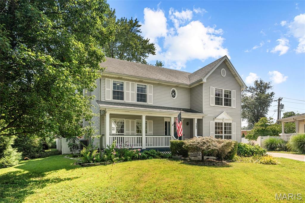 Pride of ownership shows the moment you pull up. This 1995 two-story has been cared for by the same owners since 2000, and it shows — a full-width covered front porch, wide concrete drive, detached 2-car garage, and a fully fenced backyard with mature shade trees and a private deck.

Inside, hardwood floors run through the main level. The kitchen is built for real life: granite counters, stainless appliances, generous cabinetry with glass-front uppers, a breakfast bar that seats three, and a built-in planning desk. It opens to a light-filled breakfast room with a bay window and flows into the family room with its wood-burning fireplace. A separate formal dining room with crown molding sits off the front entry, along with a flexible living room and a main-floor half bath.

Upstairs, the vaulted primary suite is a true retreat — double-door entry, walk-in closet with built-in organizers, and a private bath with dual vanity, soaking tub, and separate shower. Three additional bedrooms and a full hall bath complete the second floor.

The finished lower level adds flexible space for a rec room, home gym, or media room, with recessed lighting and durable plank flooring.

Mechanicals are solid: Carrier furnace approximately 2 years old, Carrier central air, copper plumbing, breaker panel, sump pump, and public water and sewer. NEW ROOF being installed by seller prior to closing.

Minutes to shopping, dining, and I-270. Nothing to do but move in — schedule your showing today.