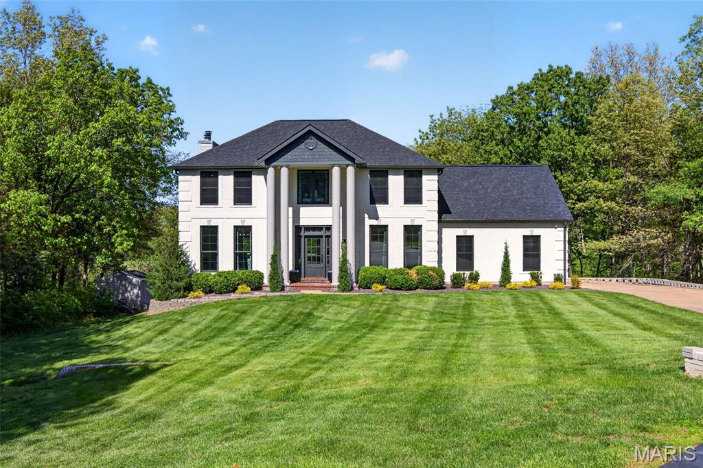 Imagine living tucked away at the end of a quiet cul-de-sac on 3 private, wooded acres, minutes from everything but feeling a world away.
This fully updated 4-bedroom, 3.5 -bath home sits on a private stocked pond, 16 feet deep, swimmable and fishable, with a newly built dock and boat included.
Recent updates touch every level of the home. The kitchen was fully remodeled with new cabinetry, solid-surface countertops, and under-cabinet lighting. The original dining room was converted into a butler's pantry and drop zone/mudroom off the garage with built-in lockers. The former formal living room now stars as the separate dining room and features tucked-away glass pocket doors. Engineered hardwood floors grace both the main and upper floors, and updated lighting can be found throughout. The main floor Great room is the central gathering place warmed by the wood-burning fireplace. But the real showstopper is the wall-to-wall sliding glass doors that illuminate the room, and bring the outdoors in! 
Upstairs, you'll find a primary suite to impress! Completely updated to include gorgeous wood flooring and ceiling, a spa-inspired luxury bath, a boutique walk-in closet, a full his closet, plus a dedicated upper-level laundry room for added convenience! 
The lower level was fully reconfigured and now functions as a second living zone: a large family room with a wood-burning fireplace, a dedicated room with hexagonal LED lighting perfect for your home gym, and a new sauna for relaxation! In addition, you’ll find a full bath, mini bar, a second laundry, and a walkout to a covered patio with underdecking overlooking the water views! 
The 3-car side-entry garage is drywalled, insulated, heated, epoxy-floored, with a built-in storage wall system and LED hex lighting.
Elevated exterior refresh all around. All new Renewal by Anderson windows. A smart home system that includes cameras, a doorbell, garage integration, and appliance monitoring. Newer composite deck. New dock. Enhanced landscaping. All ready for you to call home!