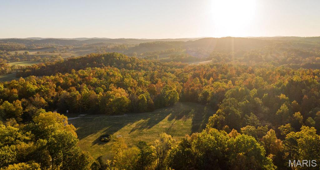 Discover an incredible opportunity to own an established and profitable short-term rental business in the heart of the Missouri Ozarks. Nestled on 38± private acres just outside of Eminence, this unique property has been successfully operating as a vacation rental destination for the past six years and offers immediate income with room for future expansion.

The property features four charming, climate-controlled cabins, each comfortably accommodating 4–6 guests. Whether visitors are enjoying their morning coffee on the peaceful back porches or relaxing after a day of adventure, the setting provides the perfect escape surrounded by nature. Approximately five acres are open, while the remaining acreage is covered in mature timber, creating exceptional privacy and additional opportunities for future cabins or recreational amenities.

Designed with efficiency in mind, the property includes an on-site office complete with a washer and dryer for laundering linens, making day-to-day operations convenient and streamlined. The business also comes with an established online presence, including a Facebook page with nearly 3,000 followers, providing valuable brand recognition and repeat customer potential.

Location is everything, and this property delivers. Situated just seven minutes from Eminence and the scenic Jacks Fork River, guests enjoy quick access to floating, hiking, horseback riding, and some of Missouri's most breathtaking natural attractions. Popular destinations such as Rocky Falls and Alley Spring are less than 20 minutes away. Adding even more convenience, two local floating outfitters pick guests up directly from the property and return them after their float, making this a highly desirable destination for river enthusiasts. The area is also a favorite for side-by-side riders looking to explore the beautiful Ozark landscape.

Whether you're looking to expand your investment portfolio with an established income-producing property or own a secluded Ozark retreat with tremendous growth potential, this turnkey business is ready for its next owner.

Seller is Owner-Agent